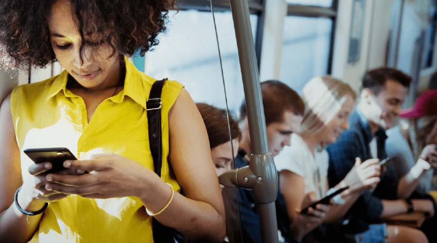 woman texting on the bus